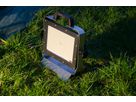 AlphaLUXX mobile LED spotlight on the ground for outdoor use for temporary lighting