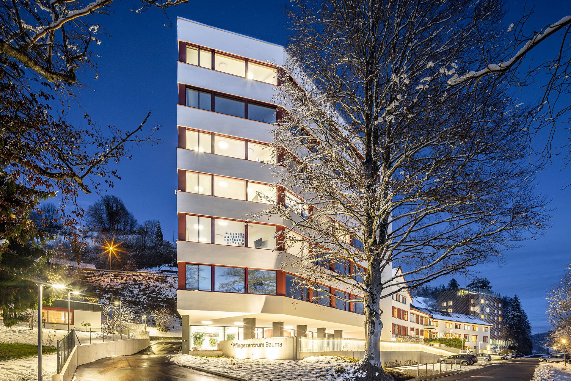 Bauma care center at night with LED guidance system LaneLED INOX for safe orientation in outdoor areas