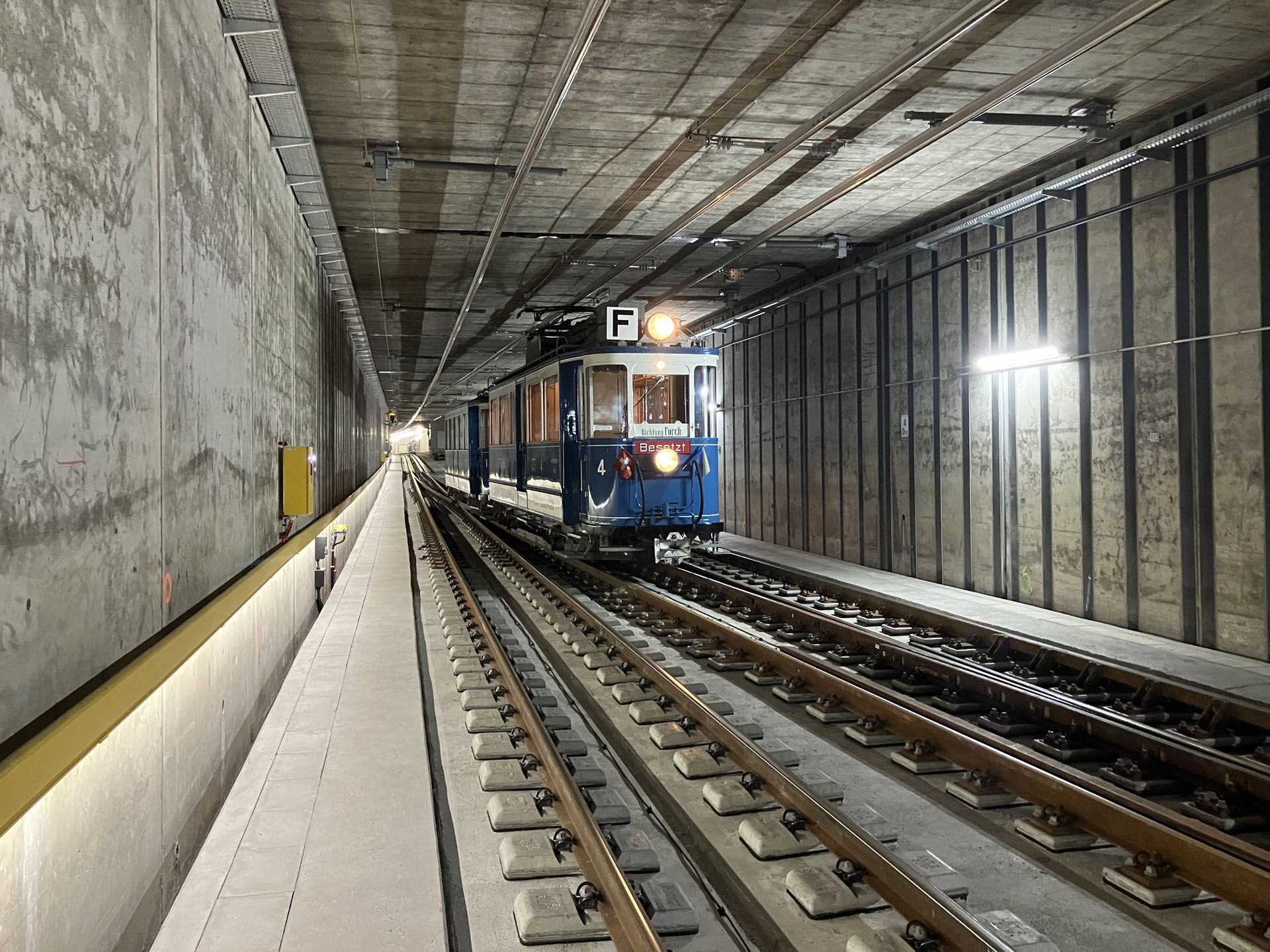 Railroad tunnel with train traffic and LED guidance system LaneLED along the maintenance route for safe orientation in the track area