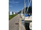 Compact energy column from GIFAS along the jetty in Brunnen harbor - power supply for sailboats and harbor facilities.