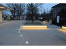 Public square with integrated floor lights and illuminated benches - safe and atmospheric LED lighting in the outdoor area