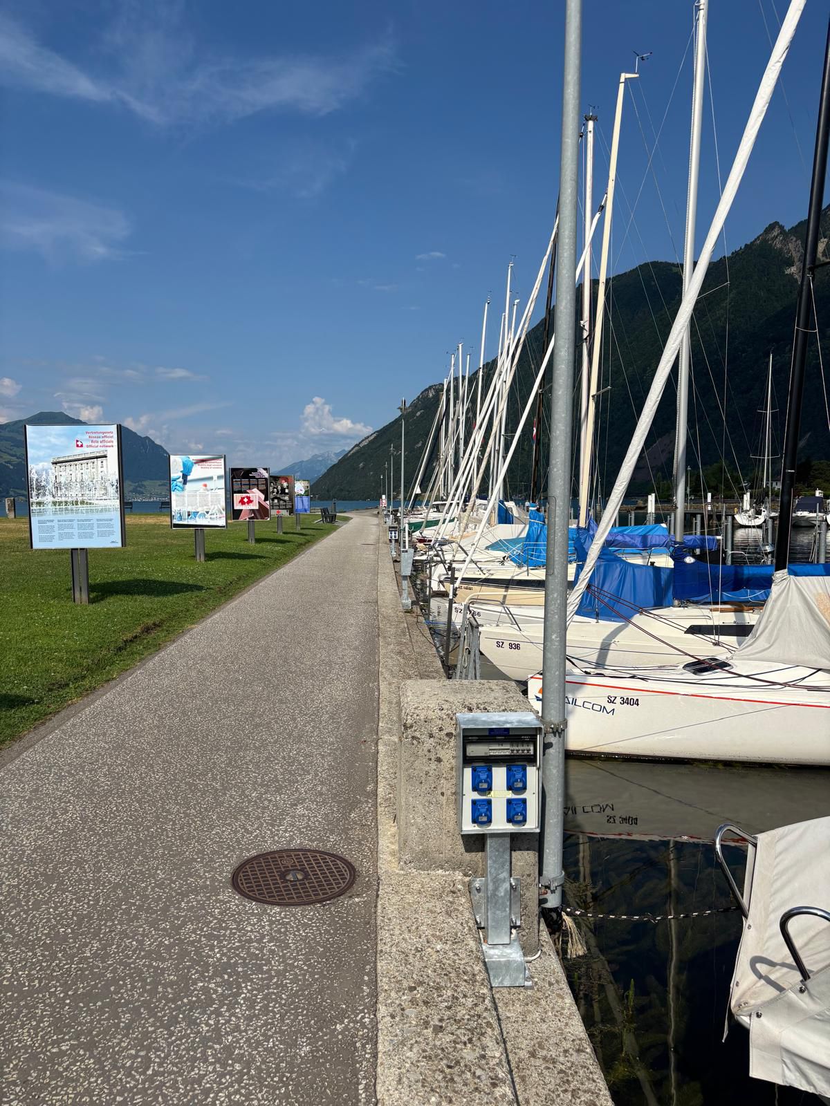 Compact energy column from GIFAS along the jetty in Brunnen harbor - power supply for sailboats and harbor facilities.
