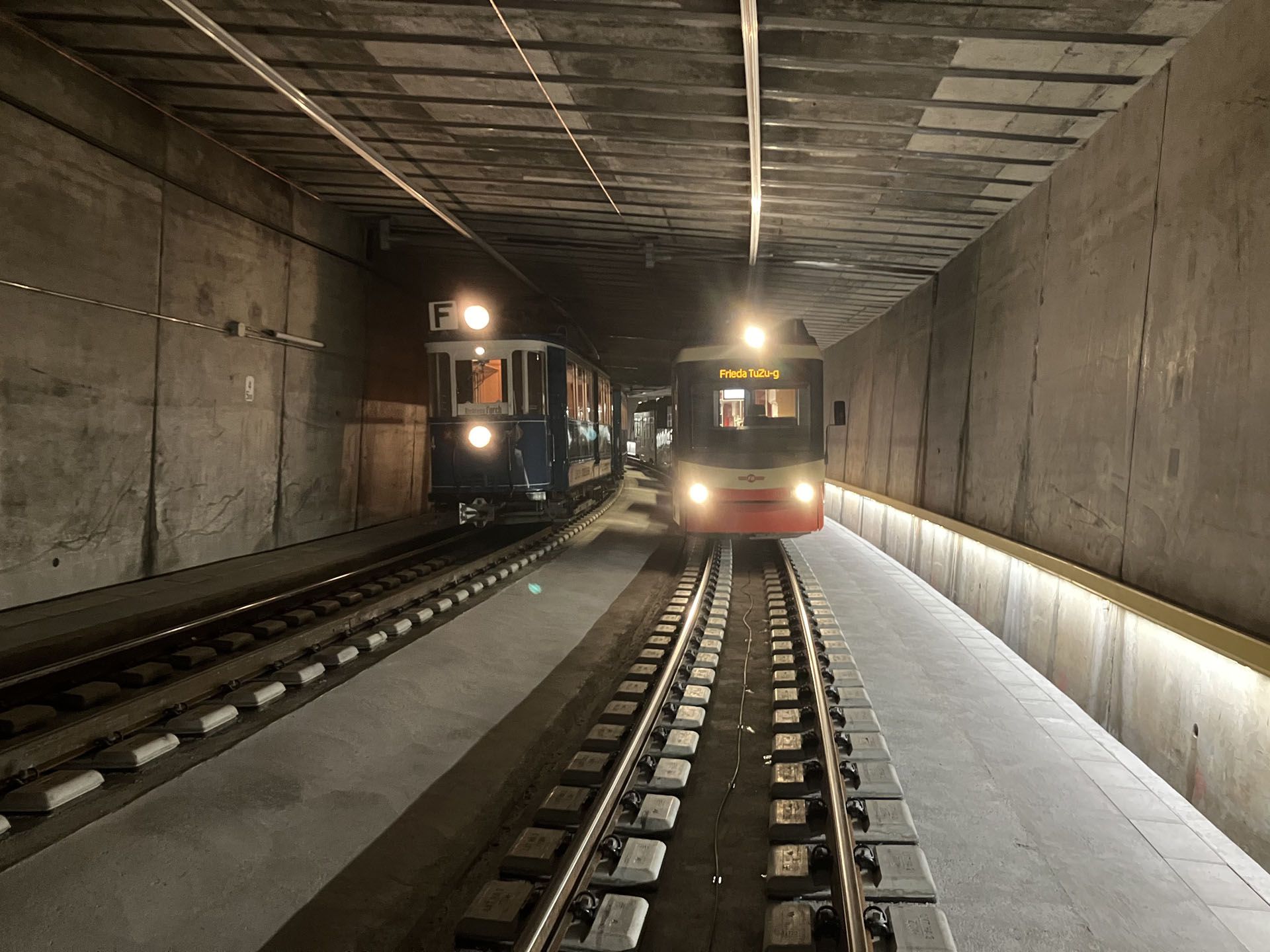 Railroad tunnel with train traffic and LED guidance system LaneLED along the maintenance routes for safe orientation in the track area
