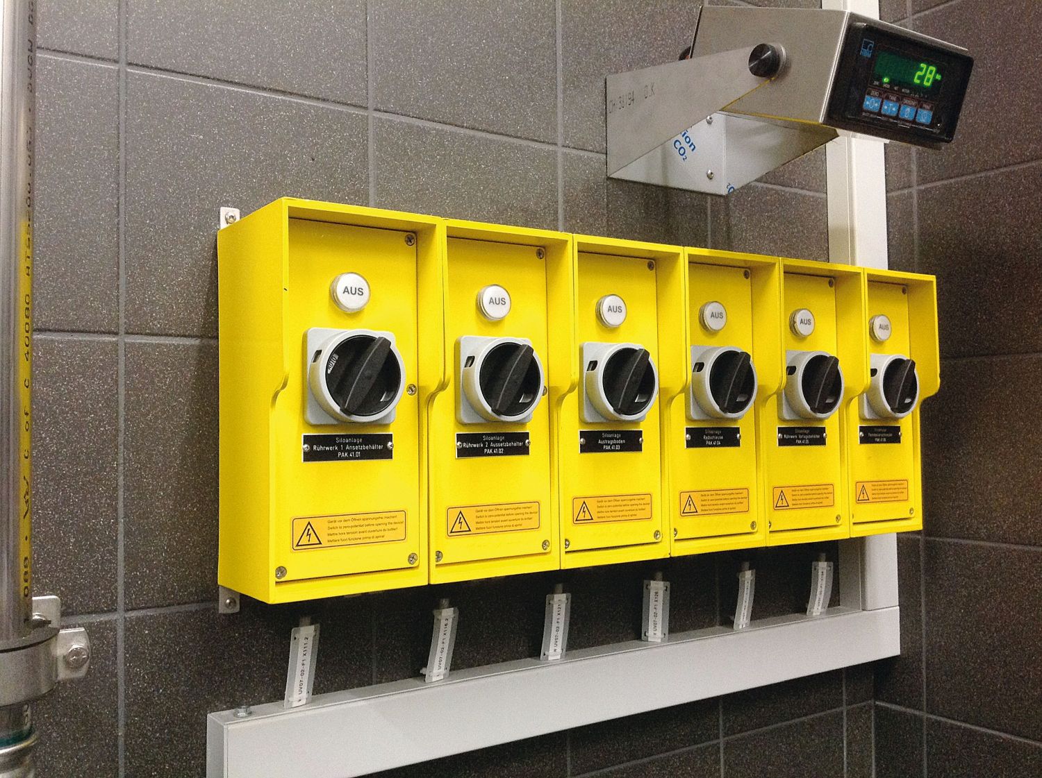 Several yellow safety switches for control and power cut-off in a wastewater treatment plant