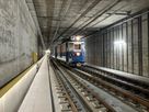 Railroad tunnel with train traffic and LED guidance system LaneLED along the maintenance route for safe orientation in the track area