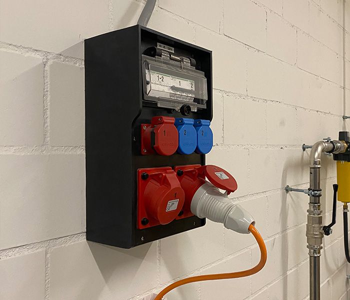 Power distributor in the electrical industry with CEE sockets and energy meter for safe power distribution