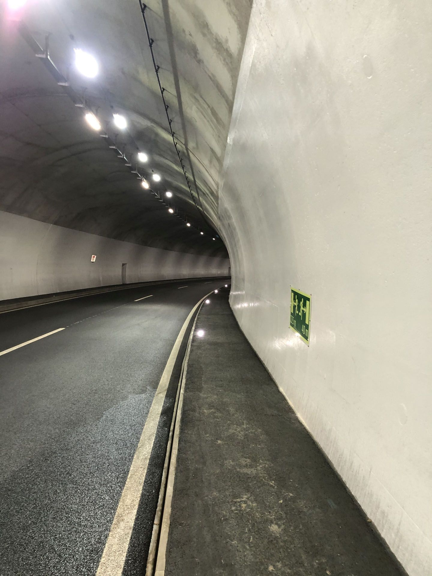 Illuminated road tunnel with MarkLED floor lights along the sidewalk for clear orientation and increased safety