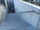 Staircase with stainless steel handrail and installed lighting at Glis cemetery