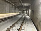 Curved rail tunnel with LaneLED LED guidance system along the maintenance route for safe orientation in the track area