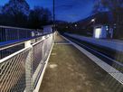 Illuminated station platform with Inox42 handrail and LED markings for safe routing in the early evening hours