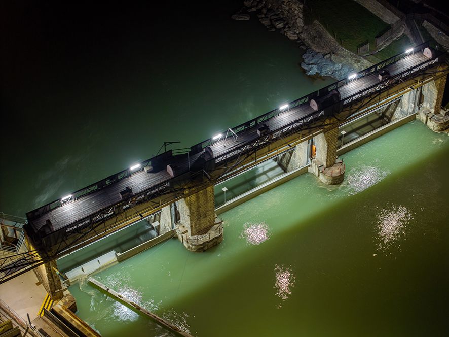 Dam at night with integrated LED lighting for safe illumination of walking and maintenance areas