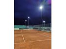 LED floodlight system on a tennis court with uniform illumination of the playing surface at night
