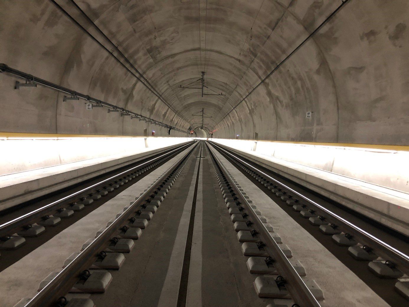 Railroad tunnel with continuous LED guidance system LaneLED along the walls for safe orientation in the track area