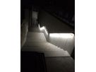 Illuminated staircase with LED handrail lighting at night at Glis cemetery