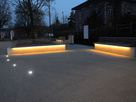 Station square with illuminated benches and integrated LED floor lights - safe and atmospheric lighting in public spaces