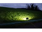Mobile LED spotlight illuminates a field at dusk - used by the army, fire department or civil defense