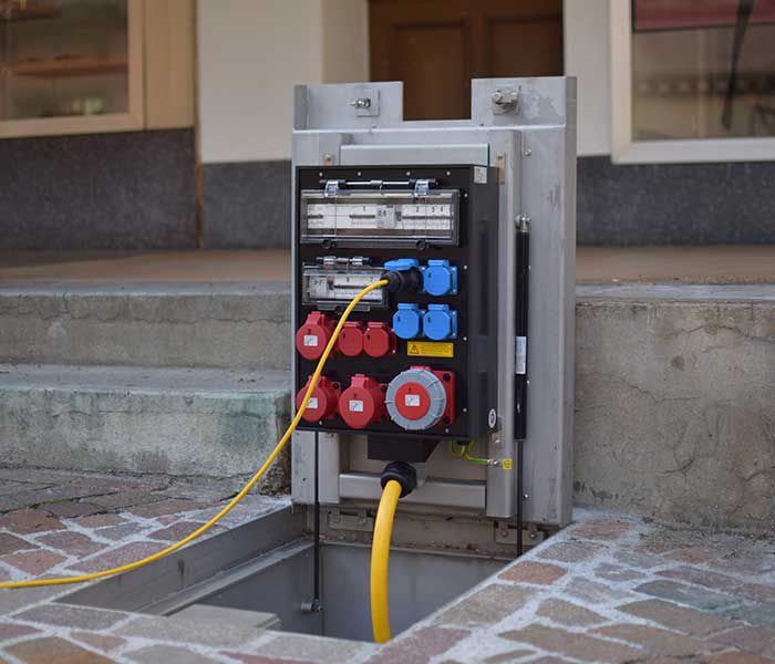 CAMPETTO with open connection panel for power supply in a public place